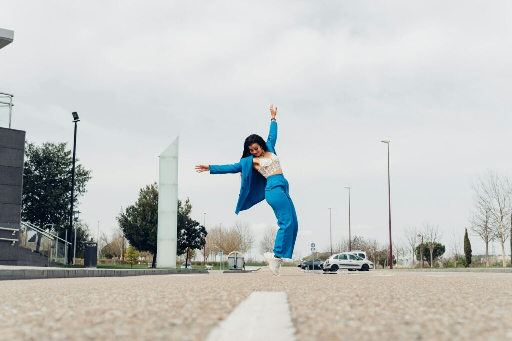 Energetic black woman standing on tiptoes