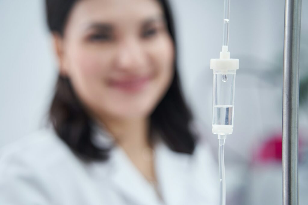 Medical concept, close up of IV drip in cosmetologist cabin