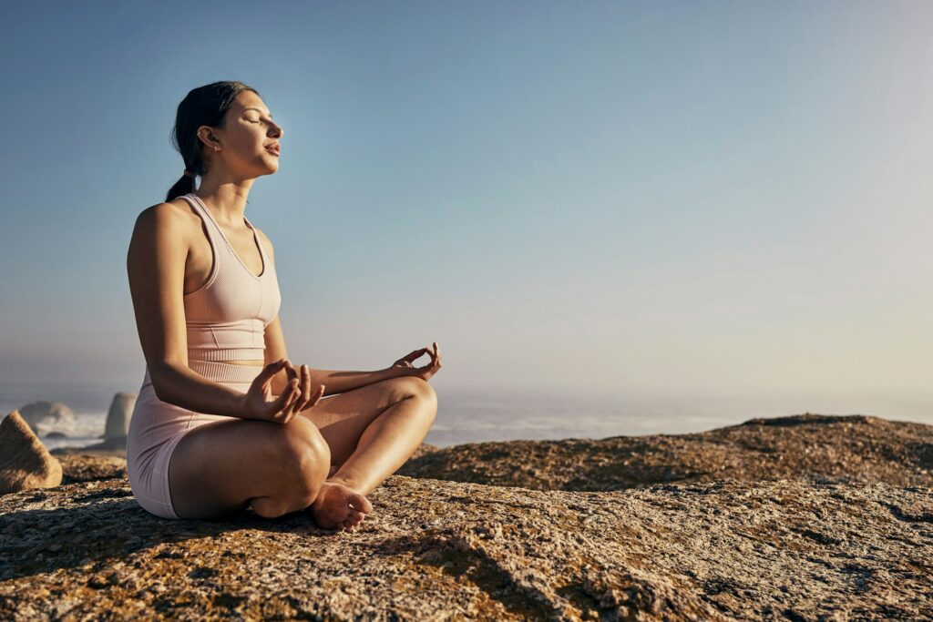 Relax and yoga and woman in lotus pose in nature for wellness, peace and zen on blue background. Fi